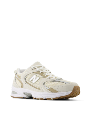 Женские кроссовки New Balance 530 тканевые молочного цвета - фото 1 - Miraton